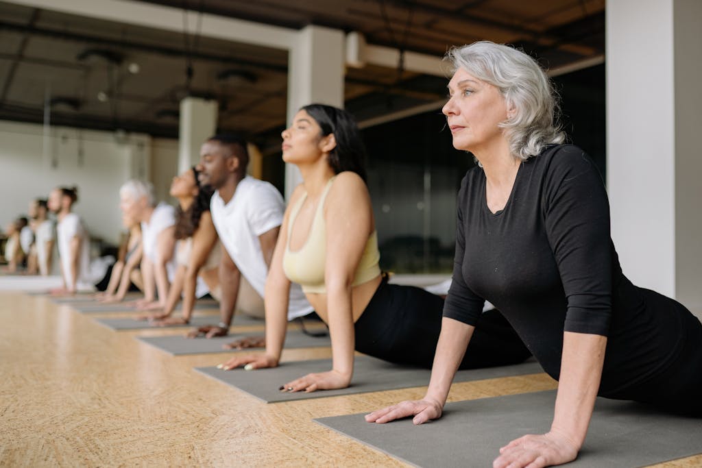 Woman in Black Body Suit Doing Yoga